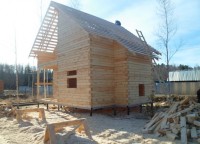 Двухэтажный дом из бруса на свайном фундаменте 7x8