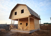 Двухэтажный дом из бруса на кирпичном фундаменте