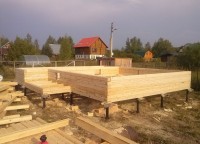 Стены первого этажа брусового дома