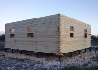 Первый этаж брусового дома на свайном фундаменте