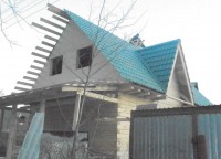 Металлочерепица на крыше брусового дома