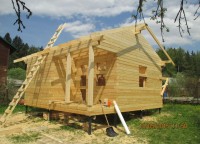 Торцевая сторона брусового дома из профилированного бруса 200x200