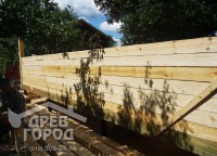 Возведение стены первого этажа брусового дома 8x9