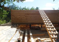Стена первого этажа брусового дома 8x9